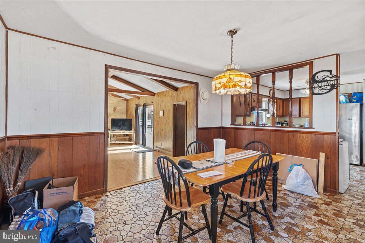 121 Catherine Avenue Buena, NJ 08310 - Photo 8 of 34 a dining room with furniture a chandelier and wooden floor
