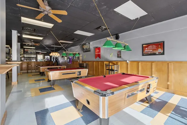 a kitchen with stainless steel appliances granite countertop a sink and cabinets