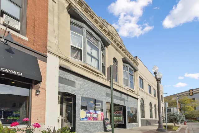 a building with car parked in front of it