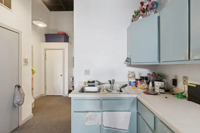 a view of an empty room with stairs
