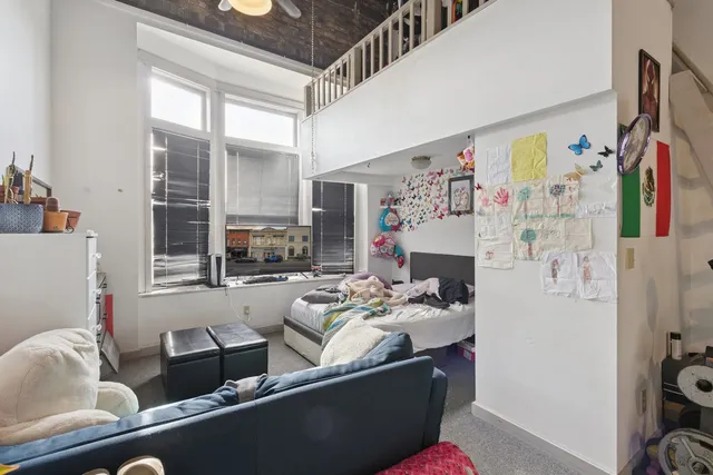 a car parked in front of a brick house