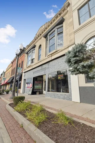 workspace with wooden floor and windows