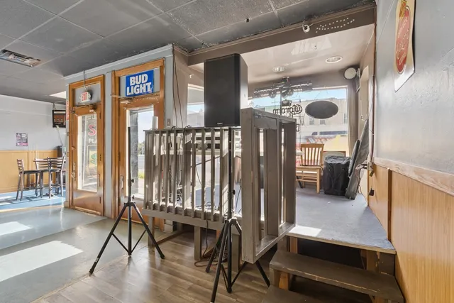 a living room with furniture pool table and a table