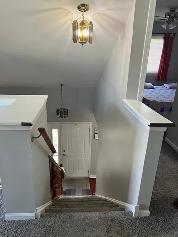 a view of a hallway with staircase