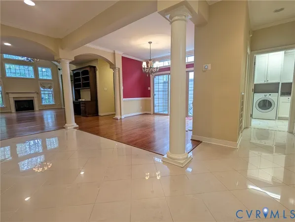 a view of a hallway with dining area