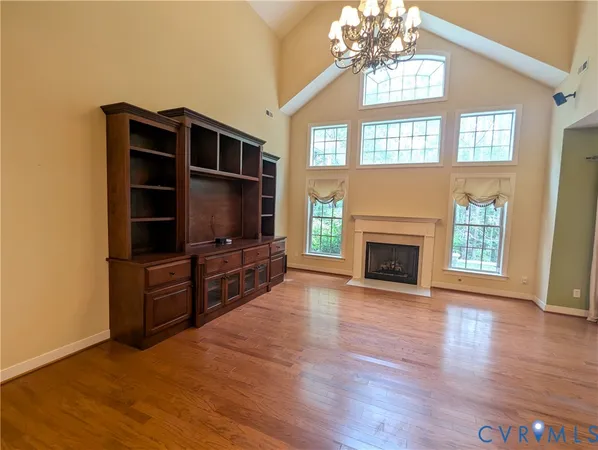 a living room with furniture fireplace and flat screen tv