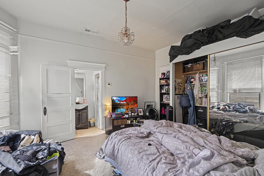 90 South 13th Street San Jose, CA 95112 - Photo 11 of 16 a bed room with a bed window and a mirror