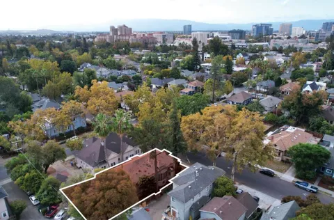 an aerial view of house with yard