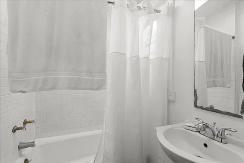 a bathroom with a sink and a bathtub