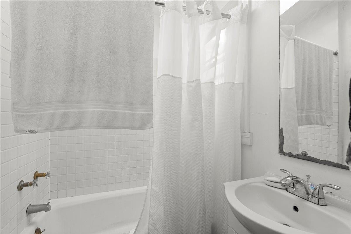 90 South 13th Street San Jose, CA 95112 - Photo 6 of 16 a bathroom with a sink and a bathtub