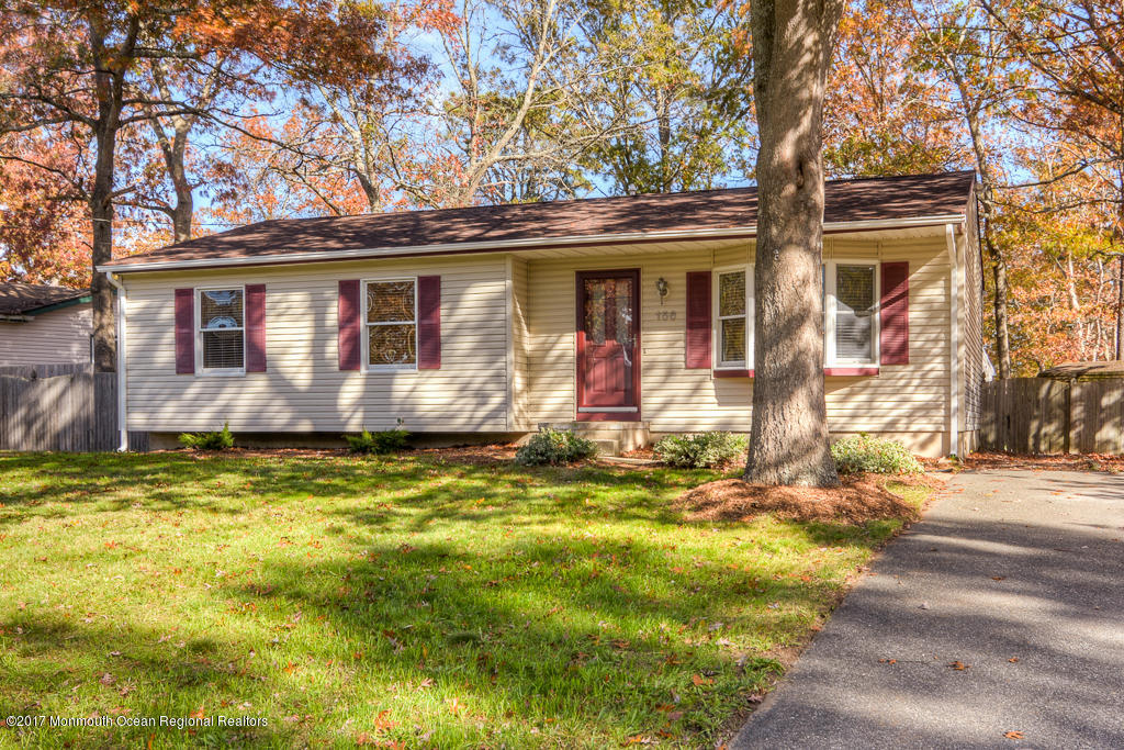 156 Wave Road Manahawkin, NJ 08050 - Photo 1 of 18 a view of a house with a yard