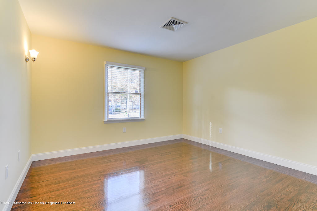 156 Wave Road Manahawkin, NJ 08050 - Photo 11 of 18 a view of a room with wooden floor and fan