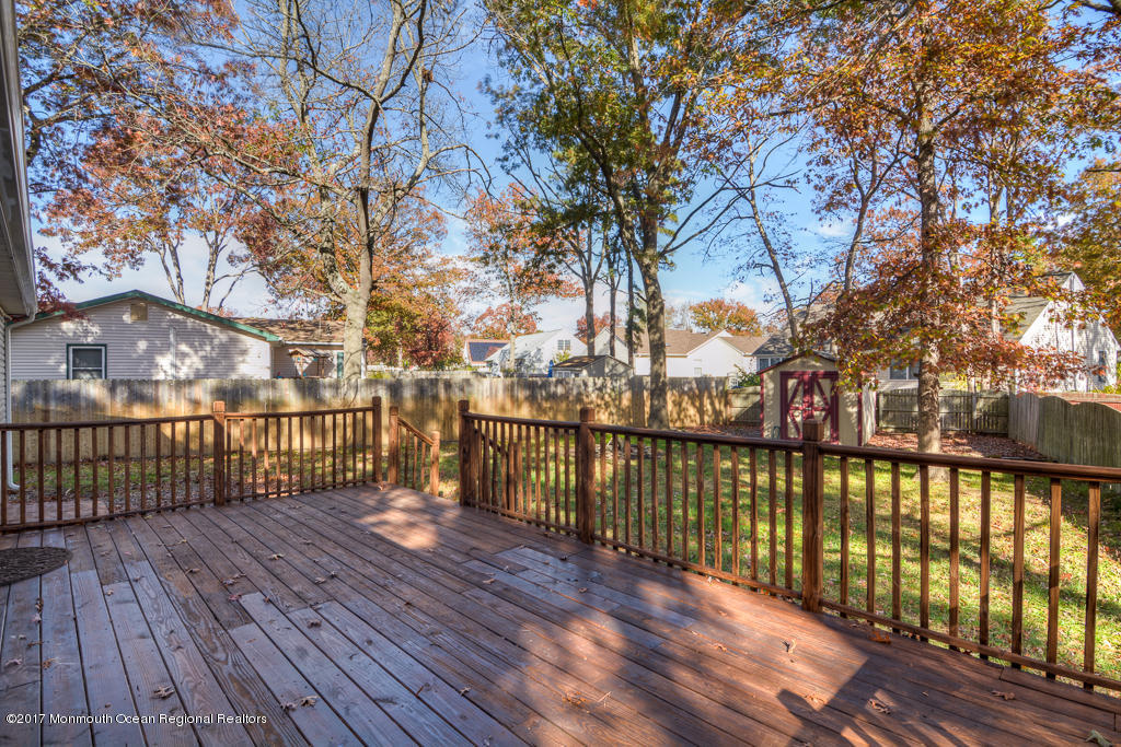 156 Wave Road Manahawkin, NJ 08050 - Photo 15 of 18 a view of a balcony with wooden floor