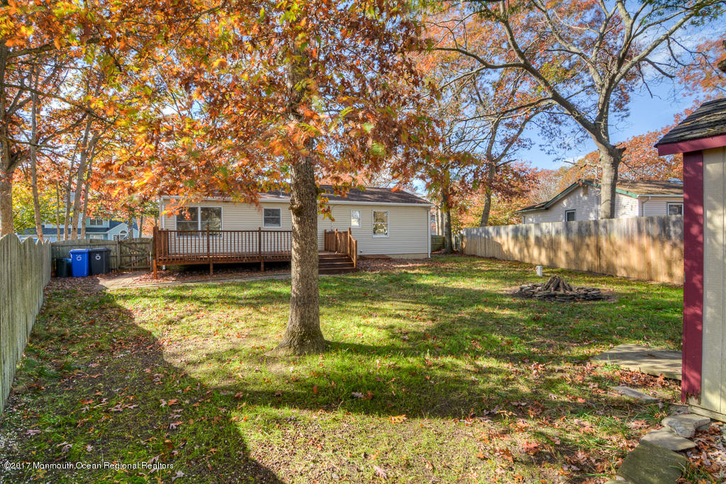 156 Wave Road Manahawkin, NJ 08050 - Photo 16 of 18 a view of a patio with a yard