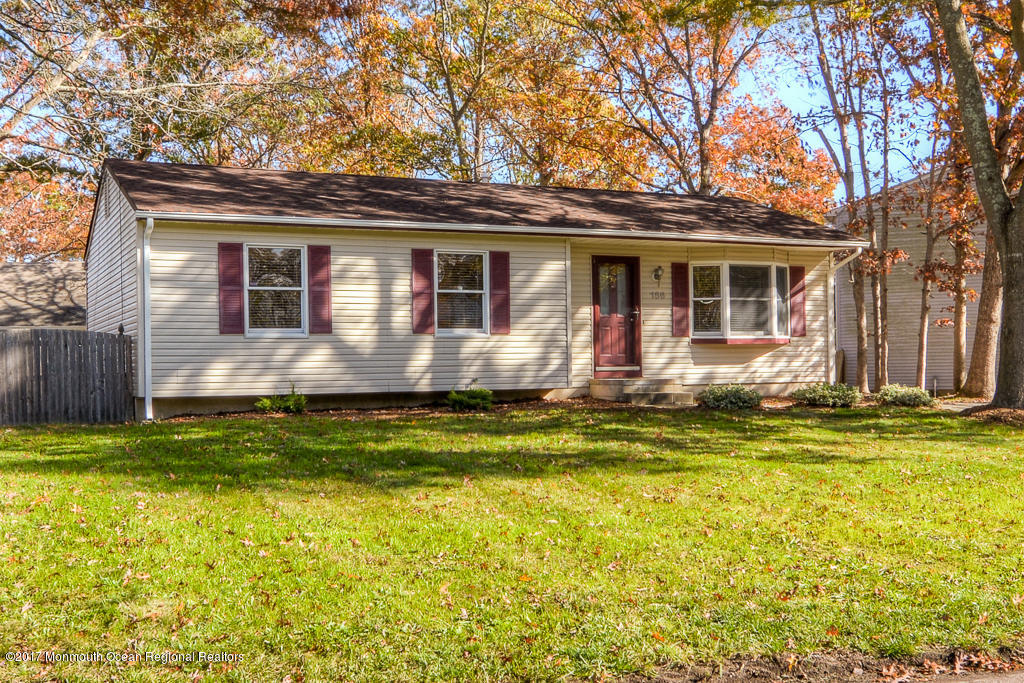 156 Wave Road Manahawkin, NJ 08050 - Photo 18 of 18 a front view of house with yard space and seating