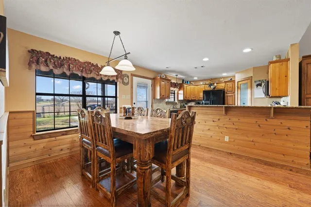 a dining room with furniture and window