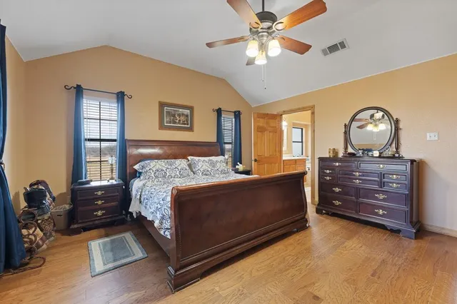 a bed room with a bed and a chandelier