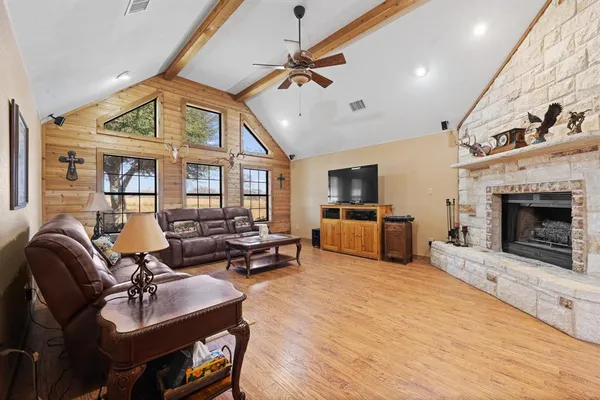 a living room with furniture and a fireplace