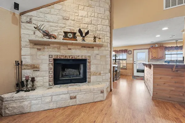 a kitchen with stainless steel appliances granite countertop a refrigerator stove and microwave