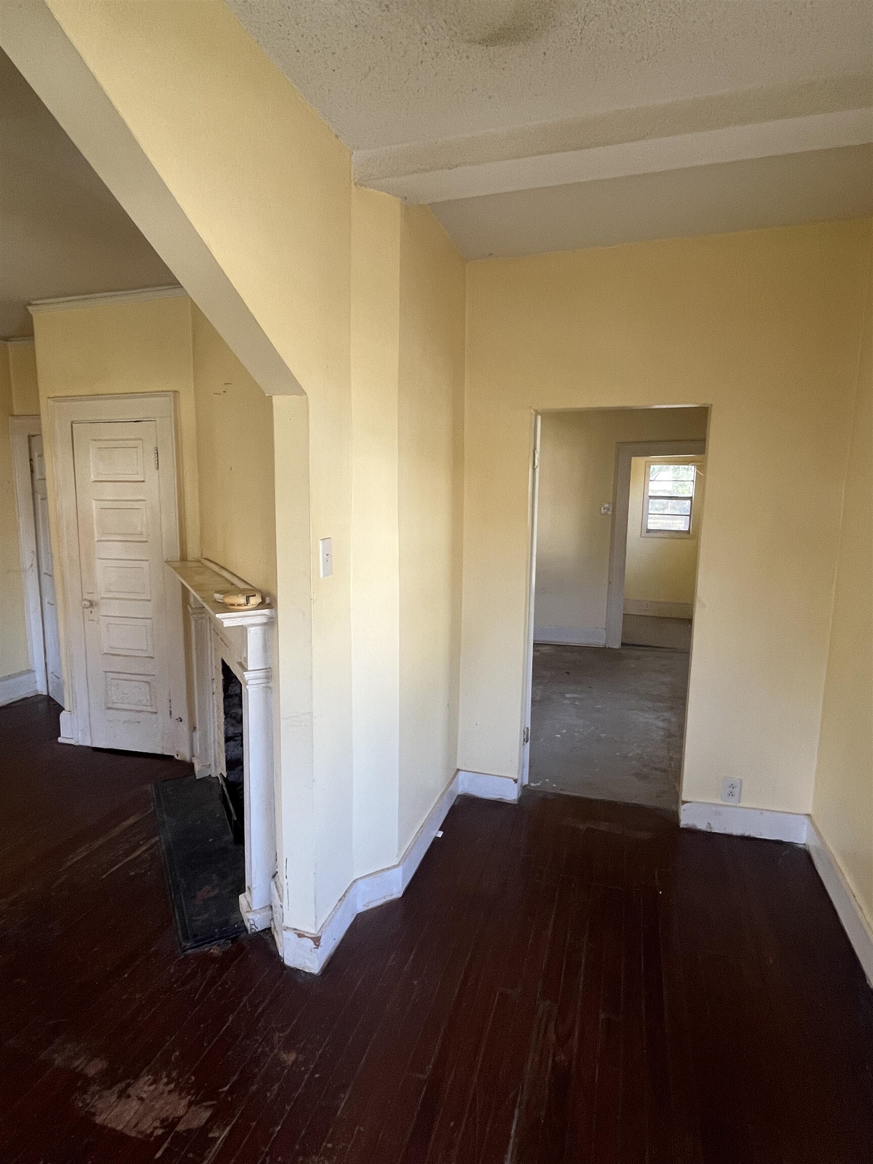 211 4th Street Mobile, AL 36611 - Photo 24 of 34 Corridor featuring dark wood-style flooring and a textured ceiling