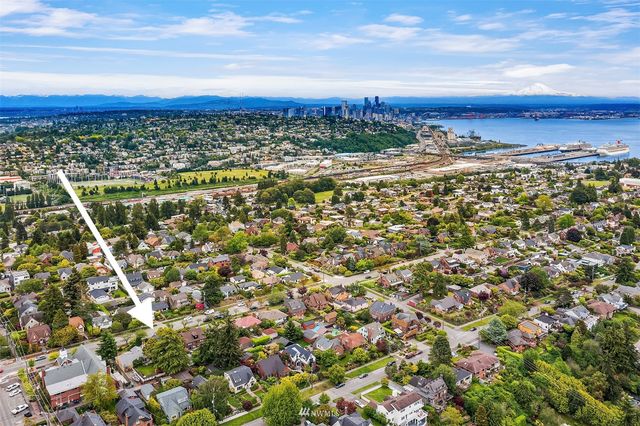 a view of a patio with table and chairs and potted plants