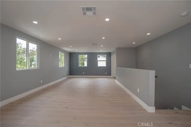 a view of empty room with windows