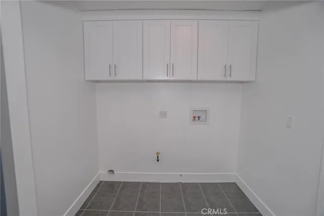 a view of storage and utility room with racks on the wall