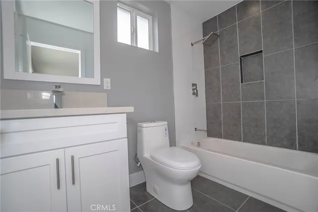 a bathroom with a toilet sink shower and bathtub