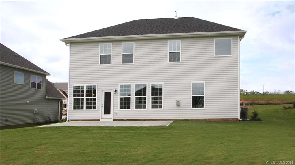5706 Joshua Cain Road, Unit L0041 Charlotte, NC 28213 - Photo 15 of 23 a front view of a house with a garden