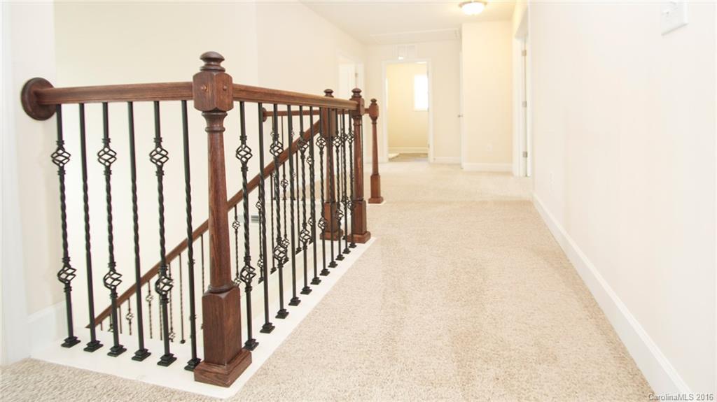 5706 Joshua Cain Road, Unit L0041 Charlotte, NC 28213 - Photo 16 of 23 a view of a hallway with wooden floor and staircase
