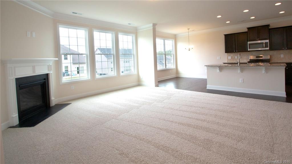 5706 Joshua Cain Road, Unit L0041 Charlotte, NC 28213 - Photo 18 of 23 a view of an empty room with kitchen and a window