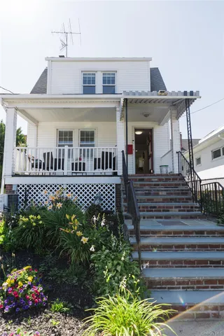 a front view of a house with a porch