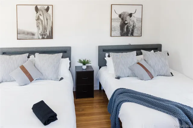 a bedroom with bed and windows