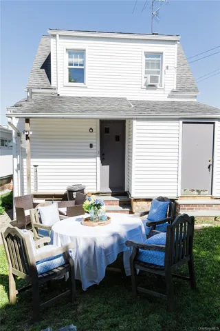 a patio with table and chairs