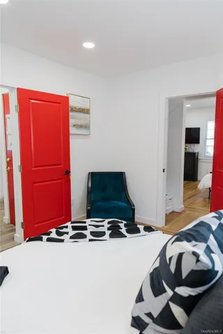 a bedroom with a bed and a chair