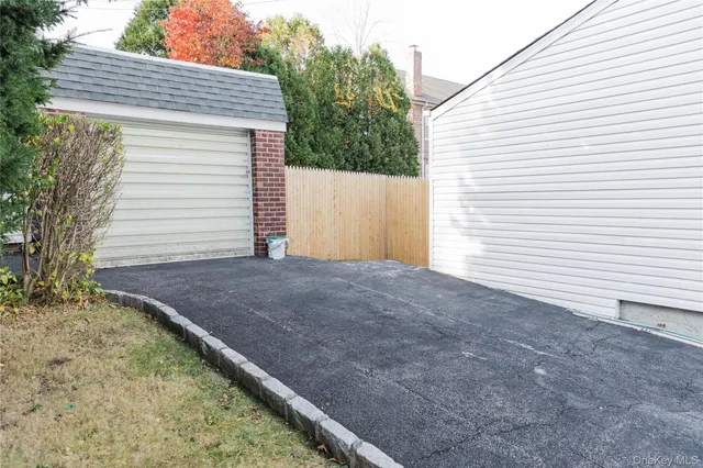 a view of a street with a house