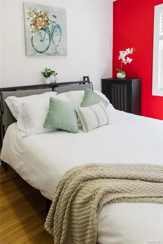 a living room with a table chairs and a window
