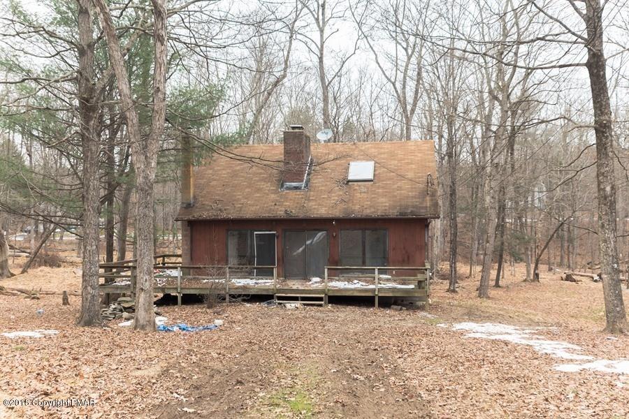 131 Rabbit Court Bushkill, PA 18324 - Photo 1 of 12 a front view of house with yard and trees