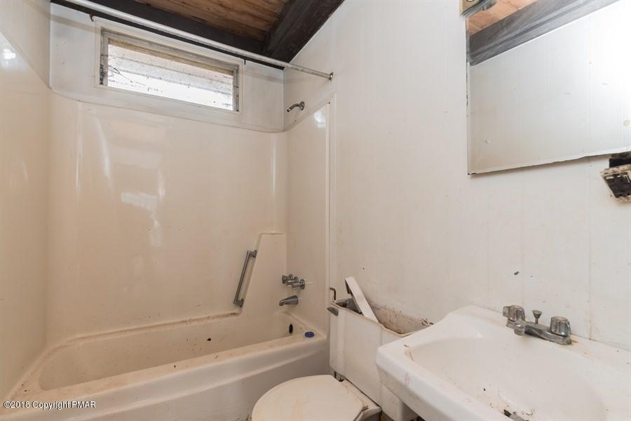 131 Rabbit Court Bushkill, PA 18324 - Photo 12 of 12 a bathroom with a sink and toilet
