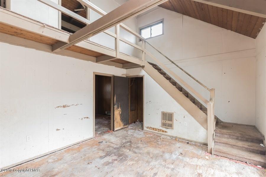 131 Rabbit Court Bushkill, PA 18324 - Photo 6 of 12 a view of a hallway with staircase
