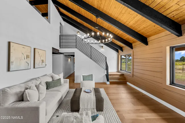 a living room with furniture and a rug