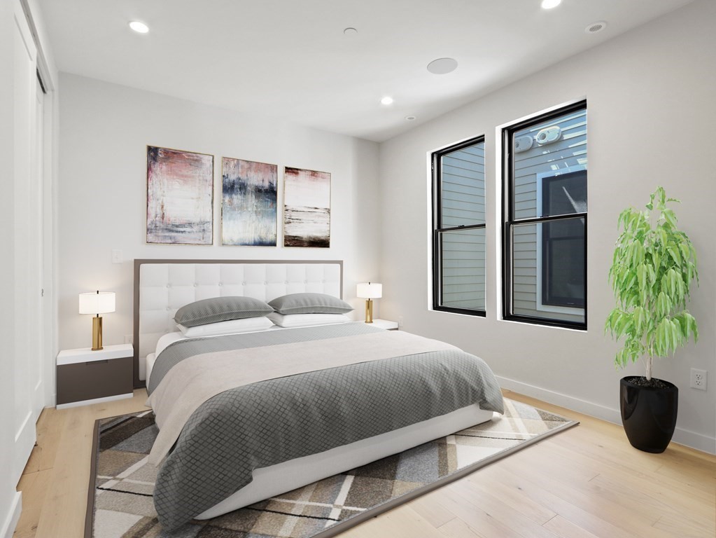 340 West 2nd Street, Unit 8 Boston, MA 02127 - Photo 1 of 38 a bedroom with a large bed and a potted plant