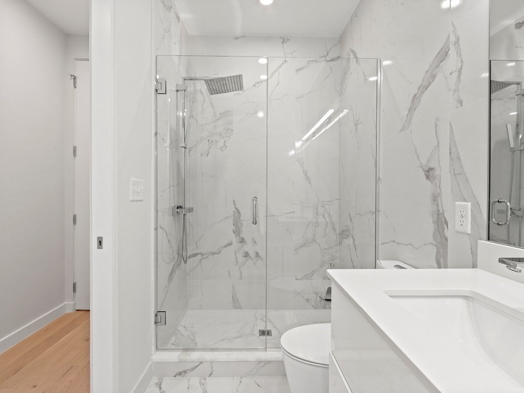 340 West 2nd Street, Unit 8 Boston, MA 02127 - Photo 14 of 38 a bathroom with a sink a toilet and shower