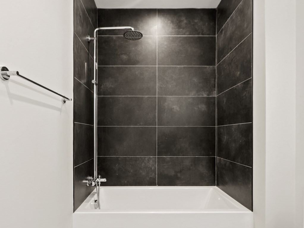340 West 2nd Street, Unit 8 Boston, MA 02127 - Photo 19 of 38 a bathroom with a bathtub
