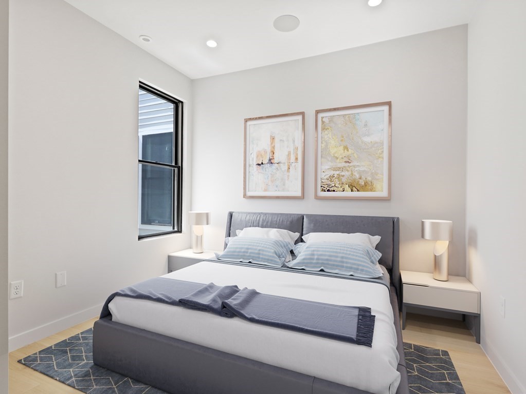 340 West 2nd Street, Unit 8 Boston, MA 02127 - Photo 2 of 38 a bedroom with a large bed and a window