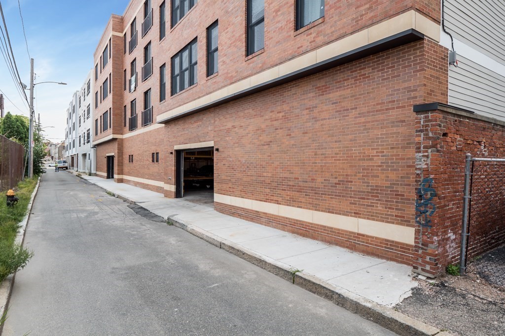 340 West 2nd Street, Unit 8 Boston, MA 02127 - Photo 23 of 38 a view of a brick building with many windows