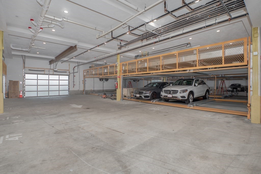 340 West 2nd Street, Unit 8 Boston, MA 02127 - Photo 28 of 38 a car parked in parking garage