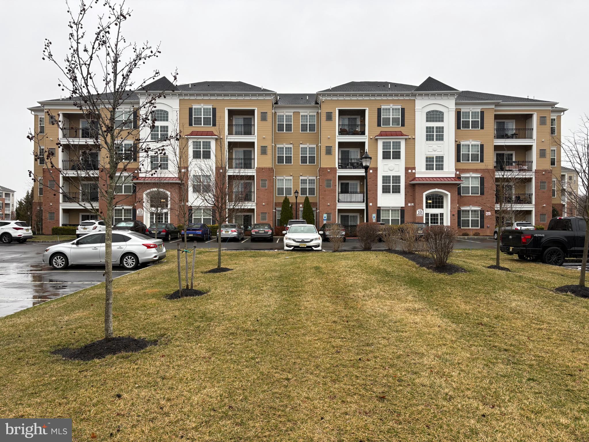 a front view of residential houses with yard