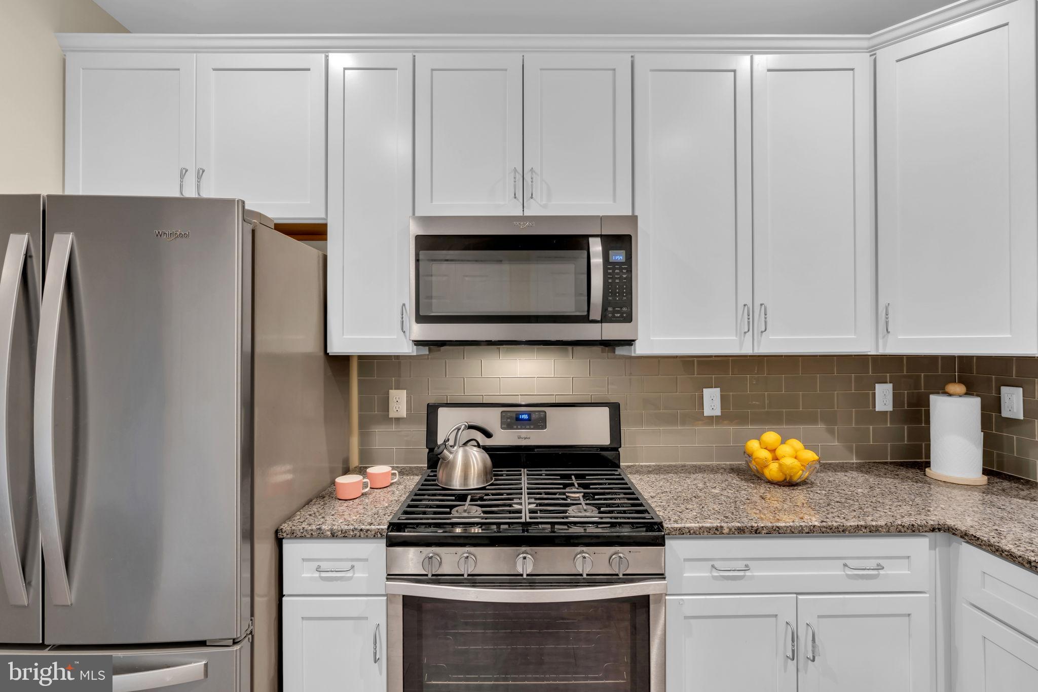 1044 Halifax Place Hamilton, NJ 08619 - Photo 7 of 39 a kitchen with granite countertop stainless steel appliances a stove a refrigerator a sink and cabinets