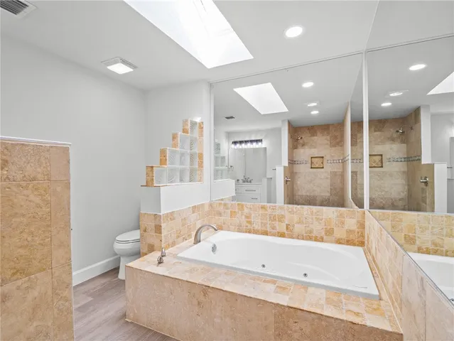 a bathroom with a bathtub and a shower